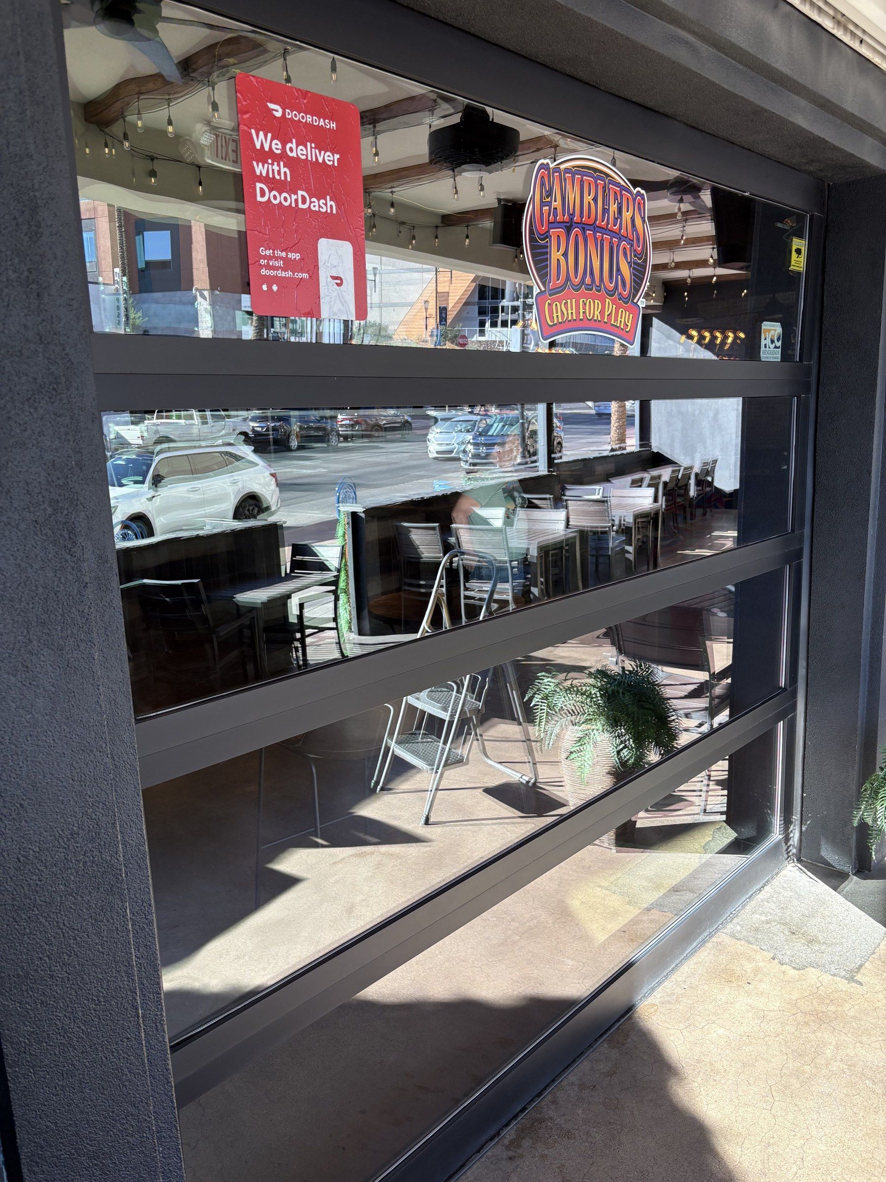 Cleaned glass roll-up door at a Las Vegas Valley restaurant, looking out to the street