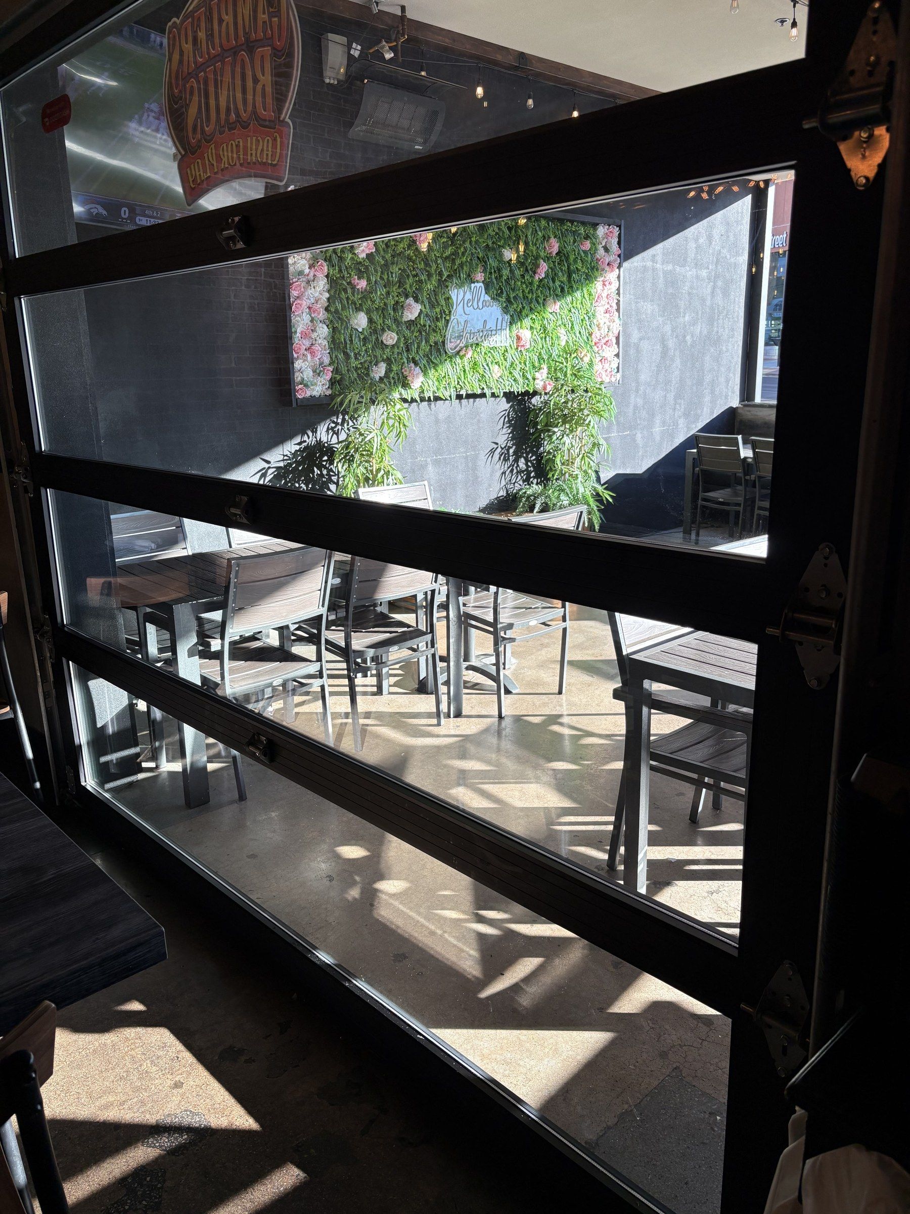 Cleaned storefront glass doors opening onto a restaurant patio in the Las Vegas Valley
